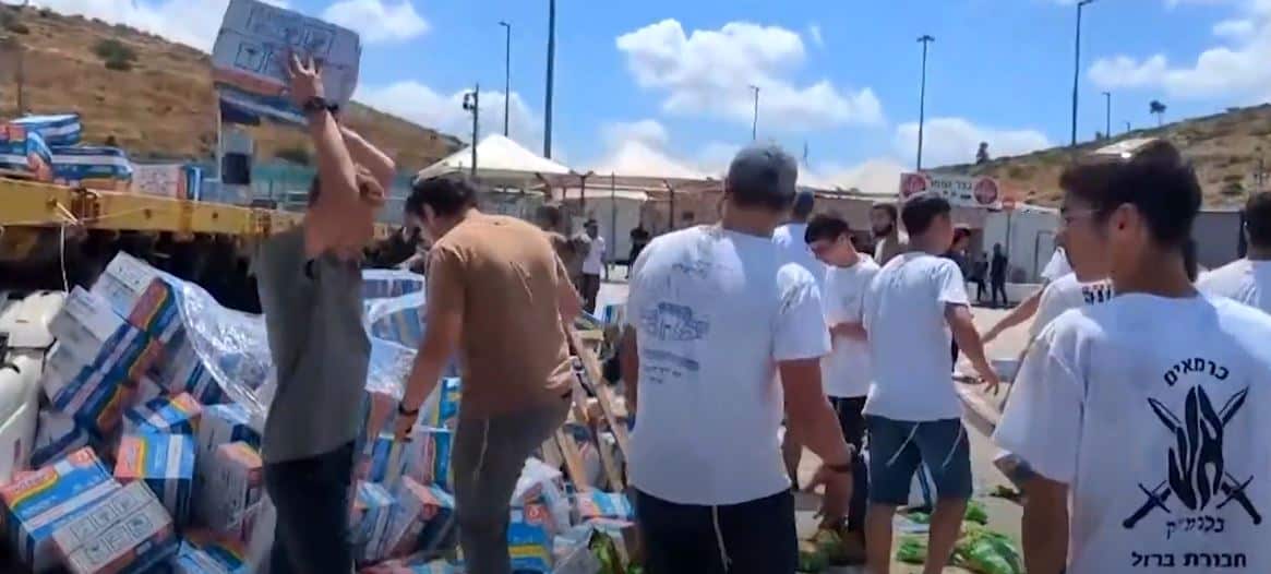 A group of people throw boxes on the ground