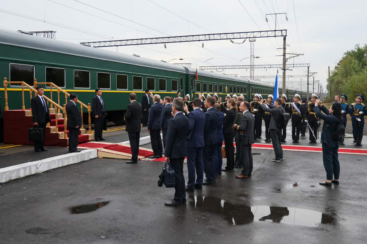 North Korean leader Kim Jong-un boards a train in Russia's Primorye Region, with lots of people and fanfare on the platform to mark his departure.
