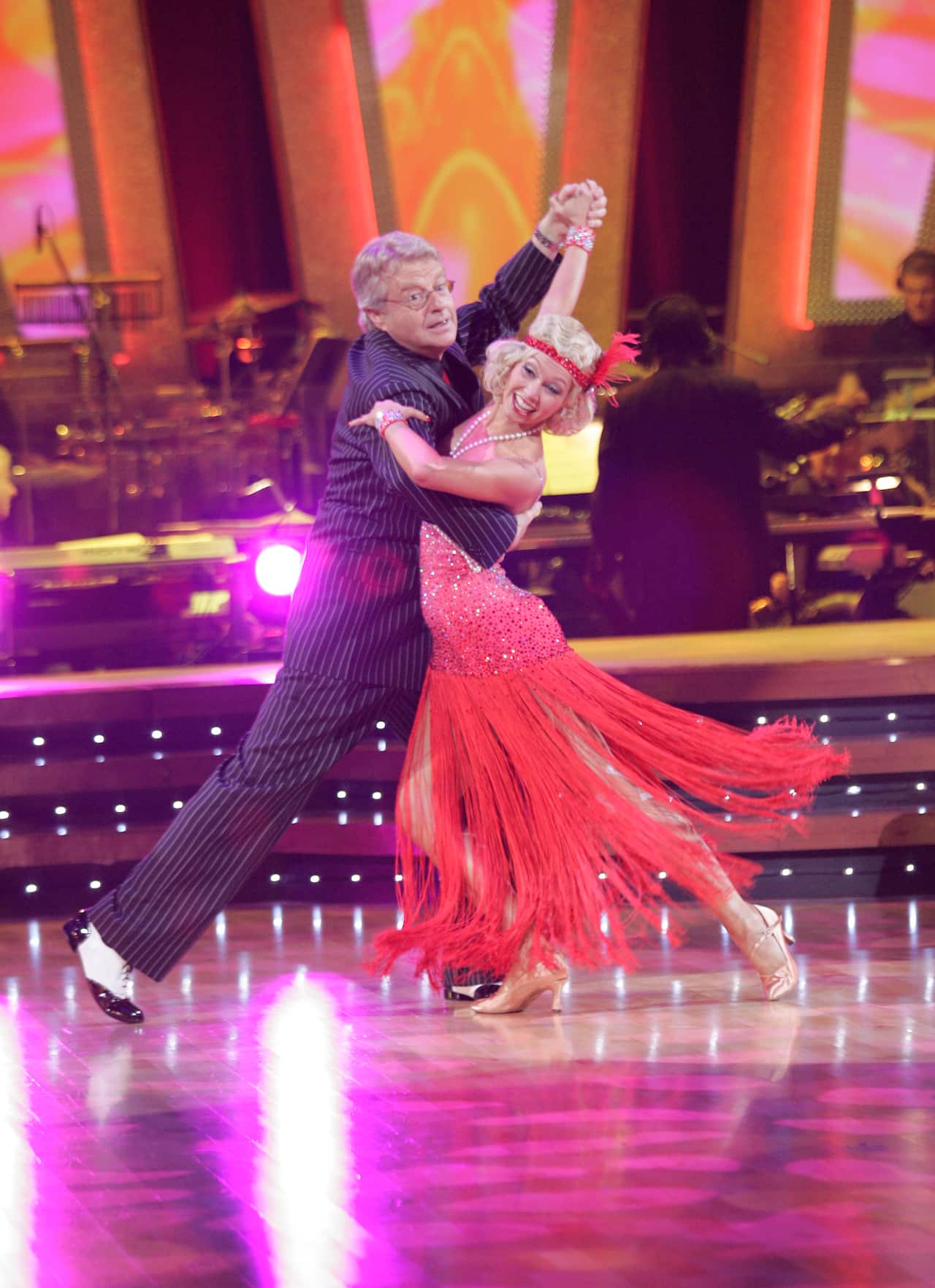 Two people dancing in costumes