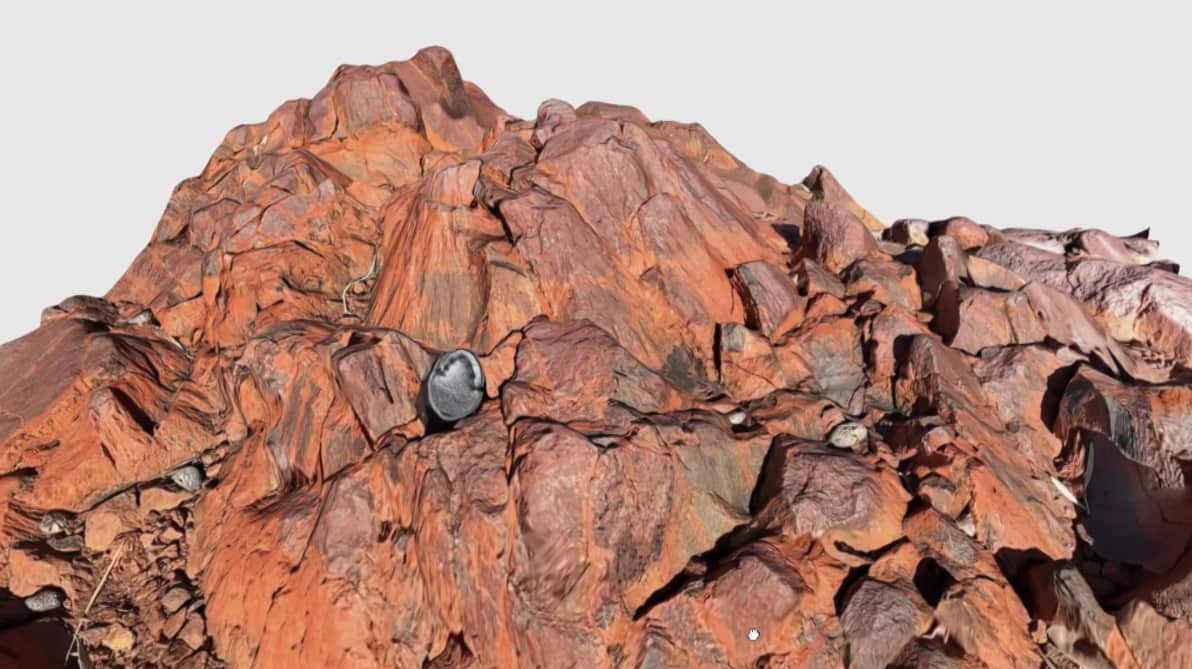 A rust-coloured rock dome 