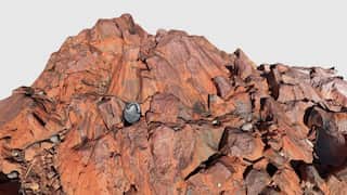 A rust-coloured rock dome