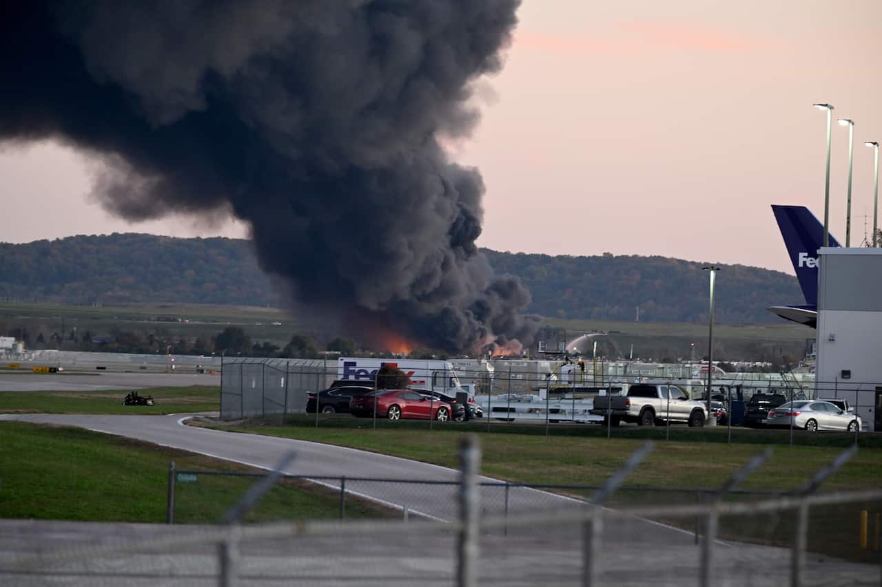 Fire and smoke are emitted from a crash scene after a plane exploded in a fireball shortly after take-off. 