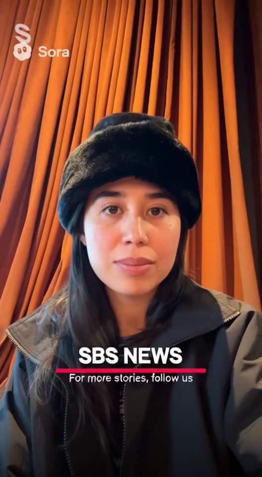 A woman wearing a black hat with the text 'SBS News' overlaid.