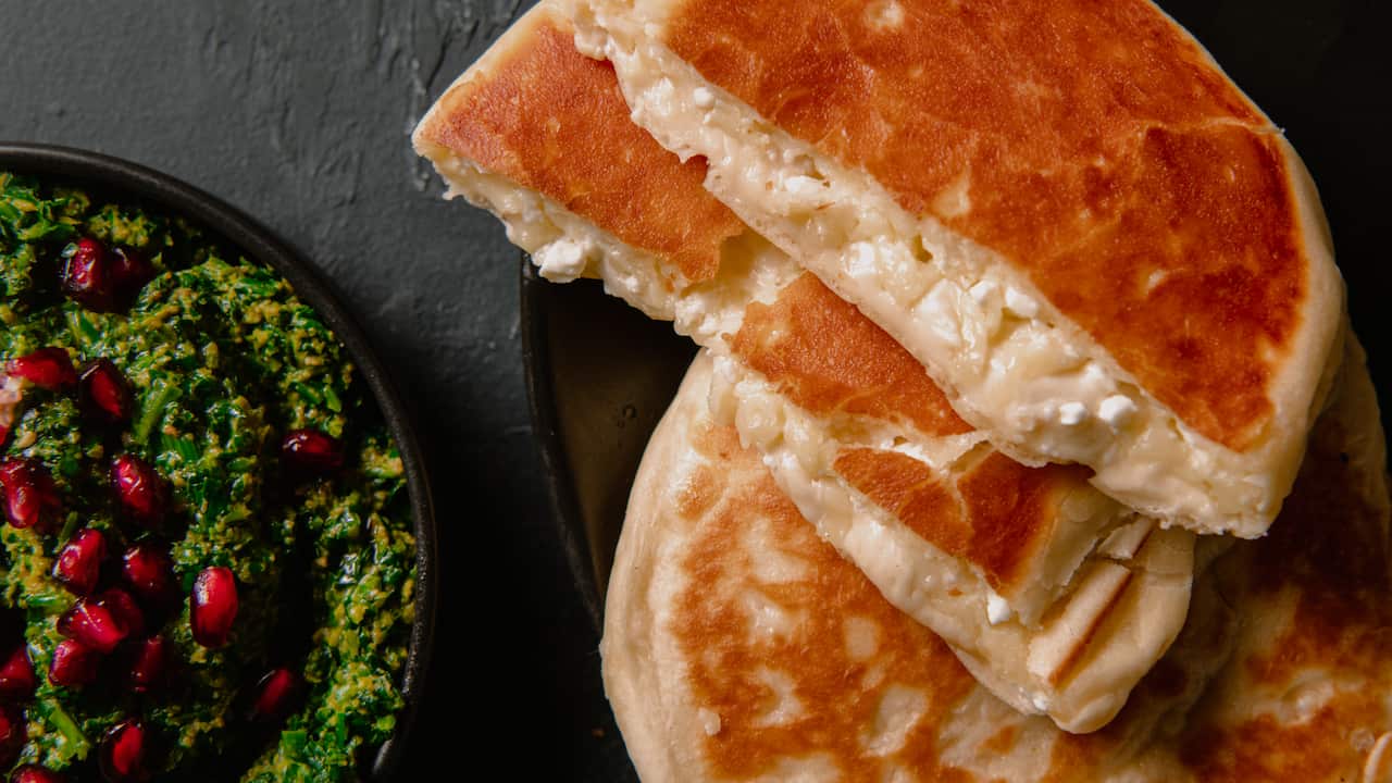 Georgian cheese bread with spinach and walnut salad (khachapuri)