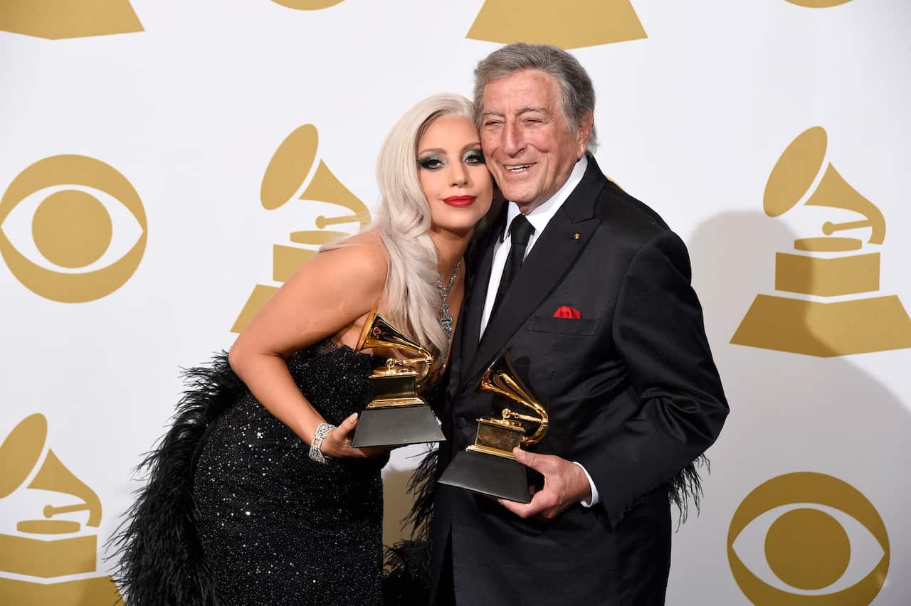 Lady Gaga and Tony Bennet hold Grammy awards