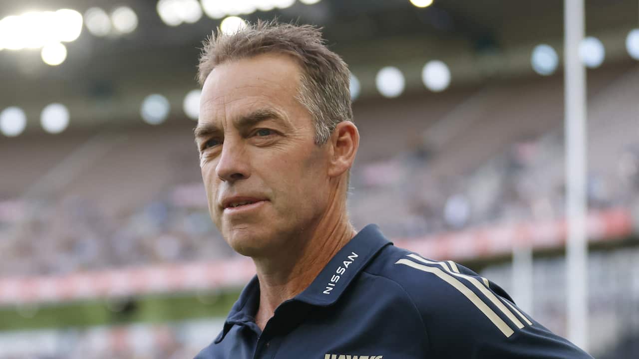 Close up of Alastair Clarkson standing on a football field
