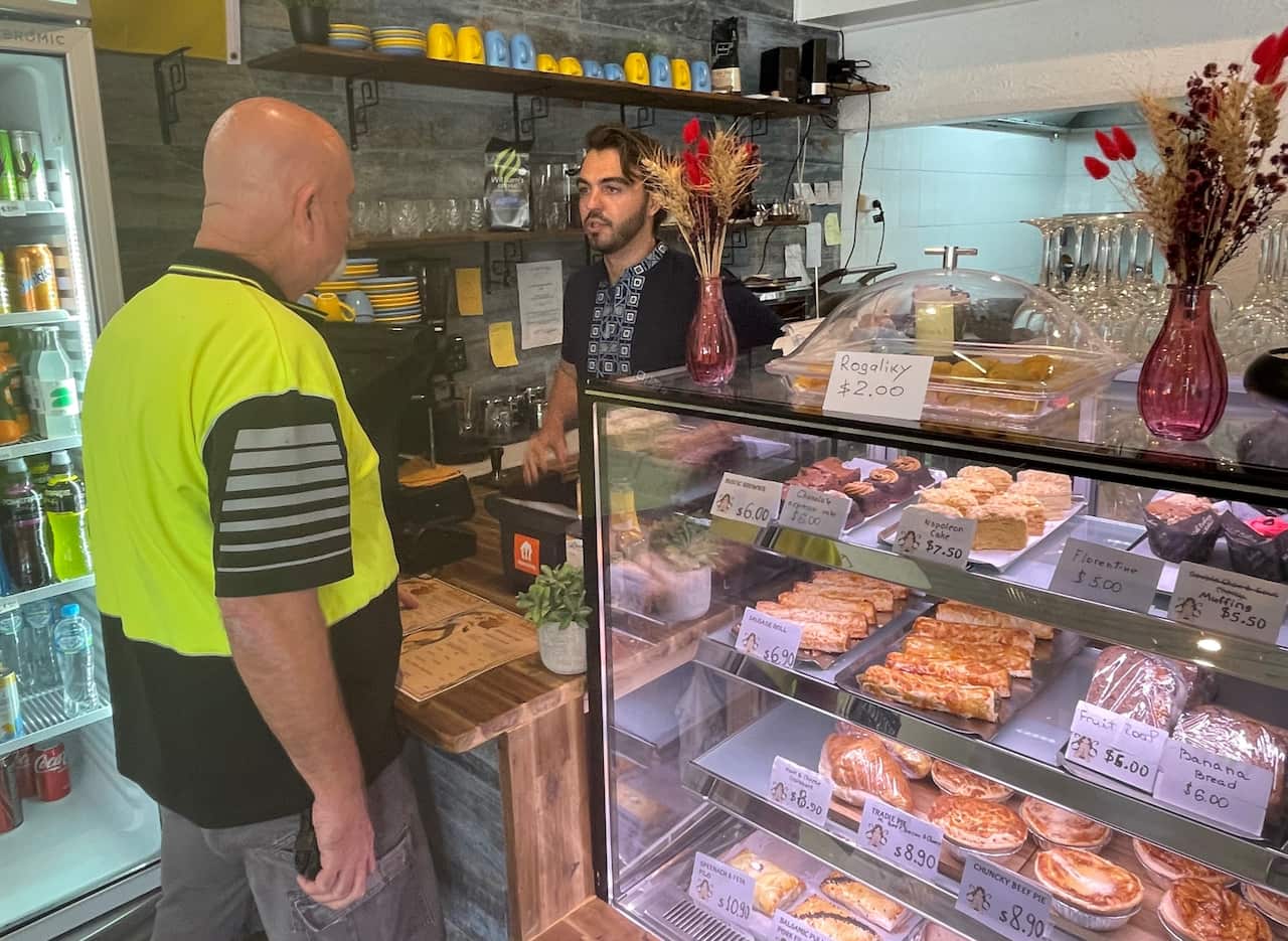 A customer at the counter inside Mavka cafe.