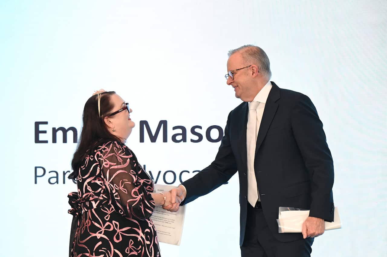 Anthony Albanese shakes hands with Australian mum Emma Mason
