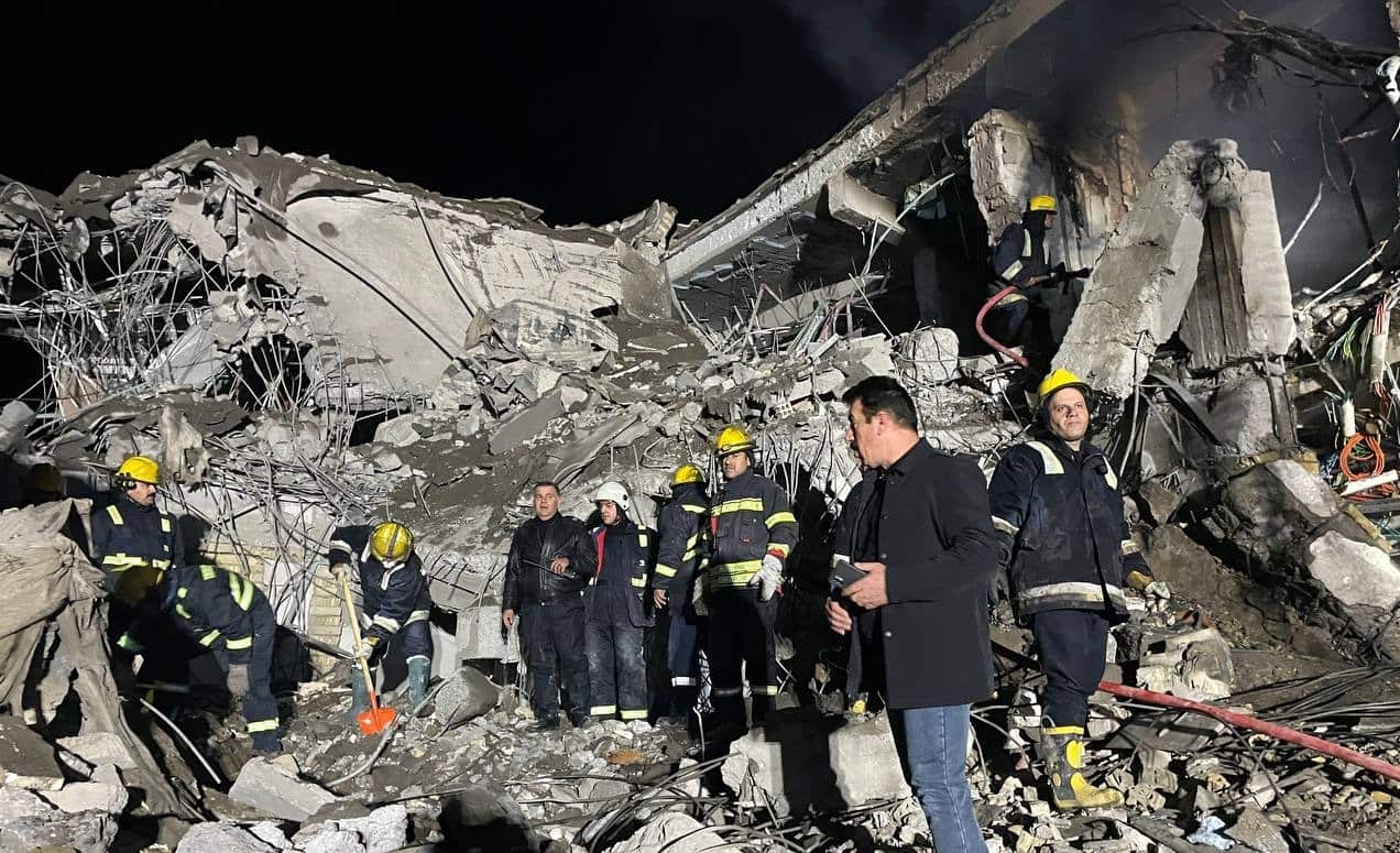 Rescuers search a building after missile attacks on several locations in Iraq's Erbil by Iran