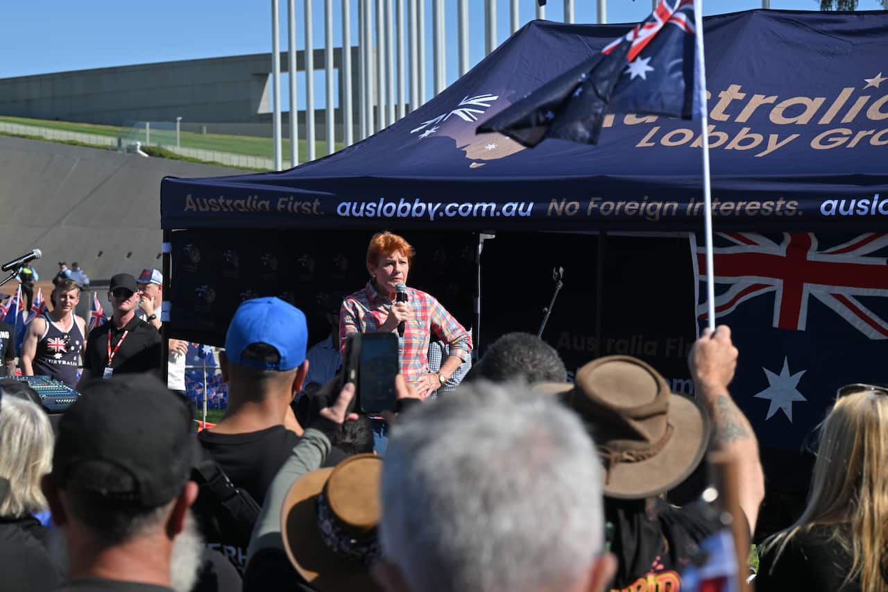 A woman addresses a protest