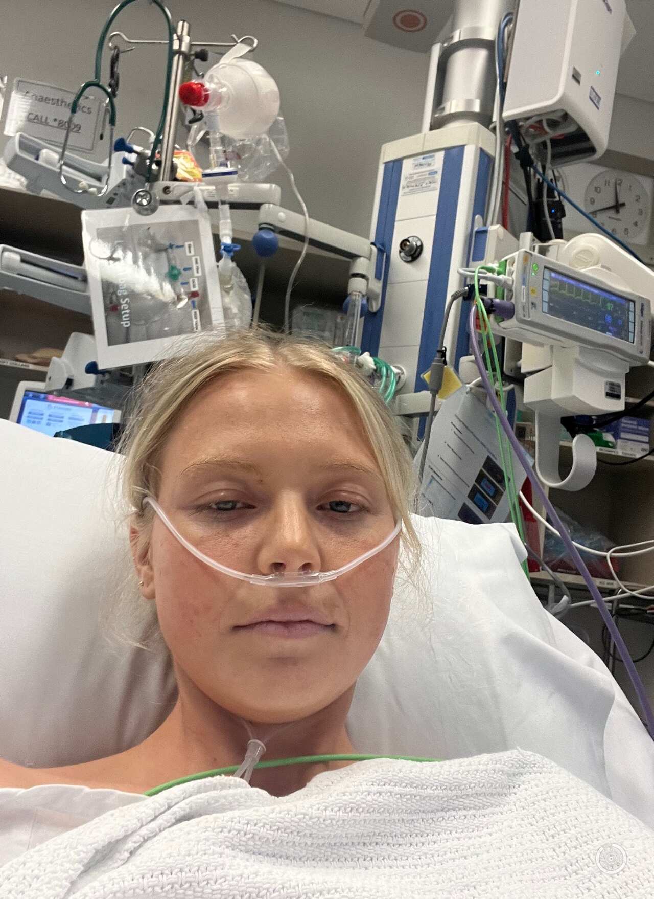 A young woman in a hospital bed with a 