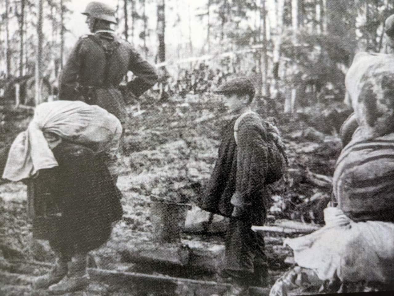 Polish children being escorted from their homes by Soviet soldiers.jpg