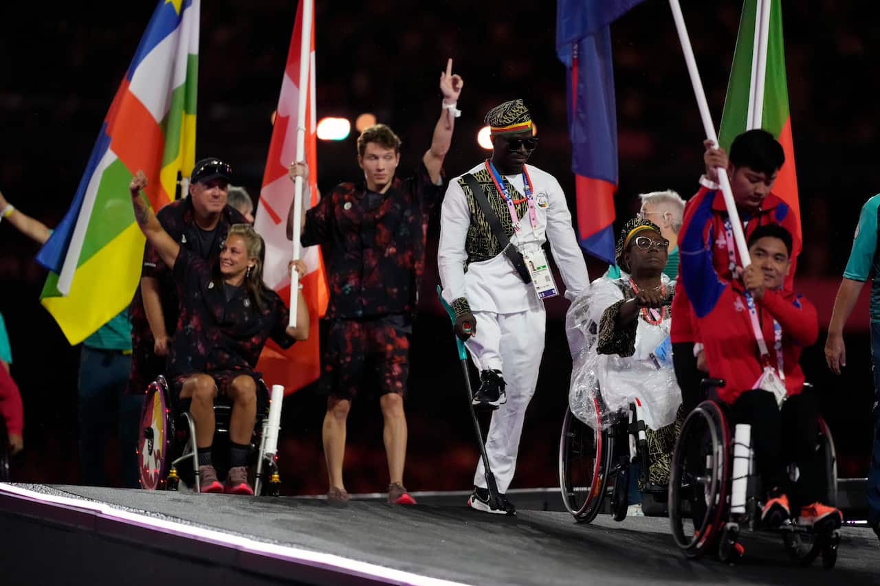 Athletes from different delegations parade during the closing ceremony of the 2024 Paralympics