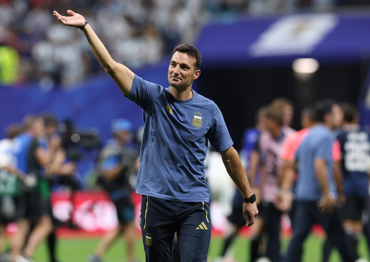 Argentine coach Lionel Scaloni waving his hand in celebration