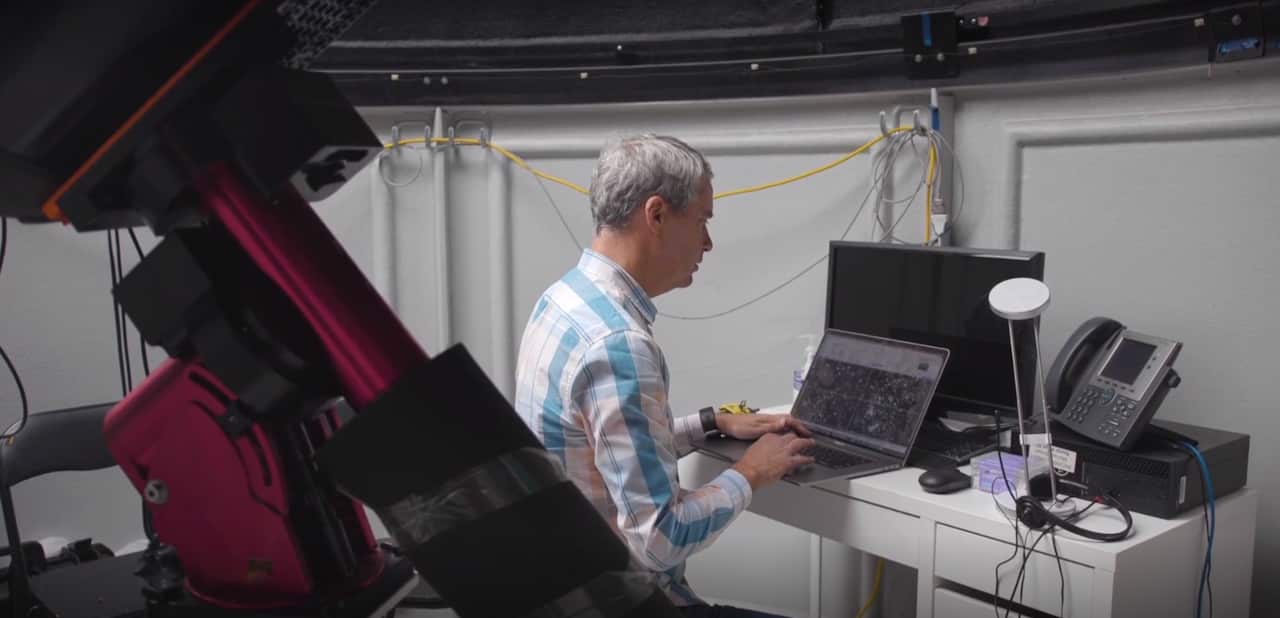 A man types at a computer.