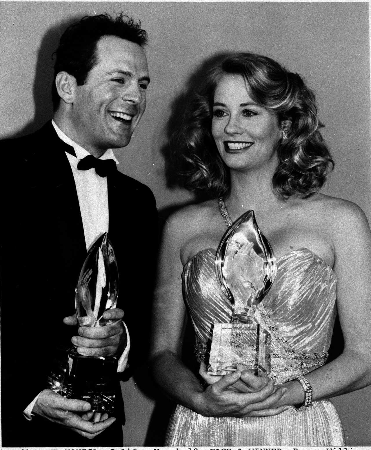 Bruce Willis and Cybill Shepherd are seen holding awards during the 1986 People's Choice Awards in Santa Monica.