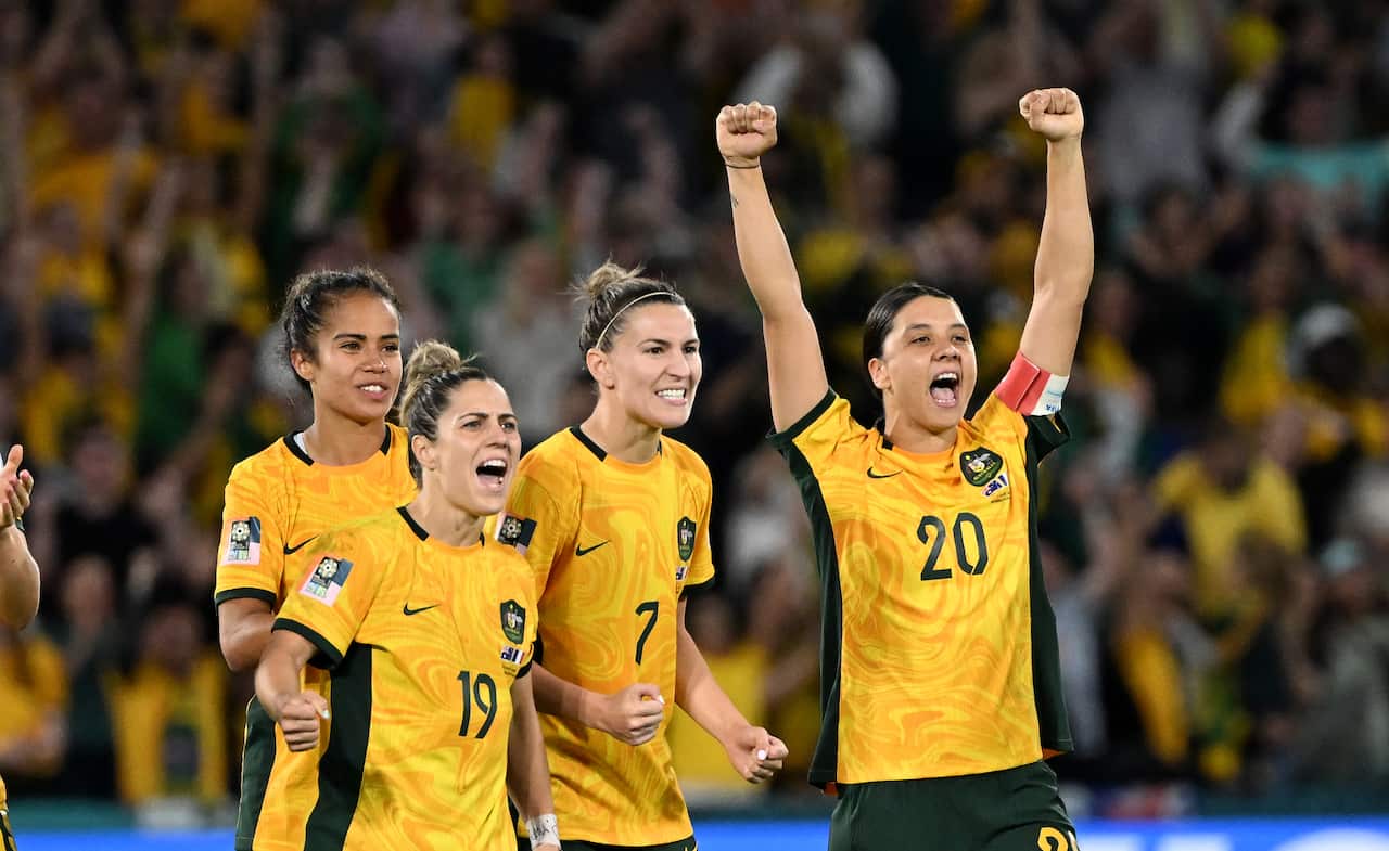 Mary Fowler, Katrina Gorry, Steph Catley and Sam Kerr of Australia cheer during a penalty shoot-out in Brisbane