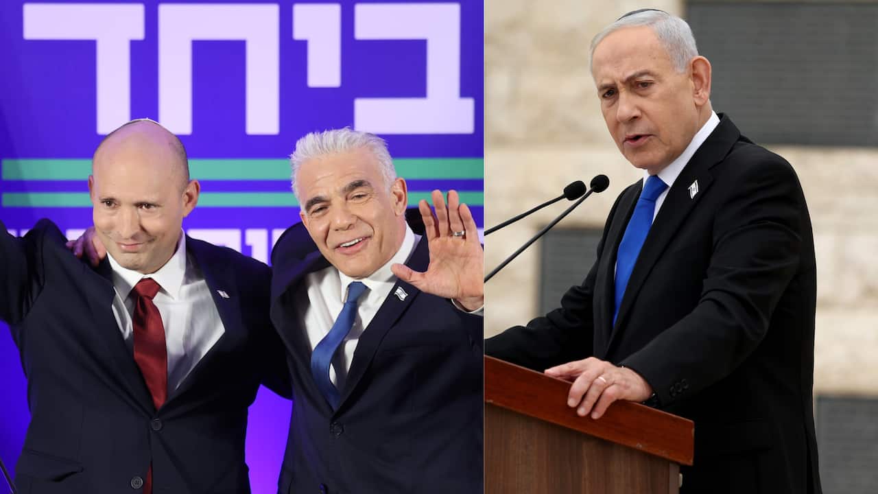 Two men waving as they embrace and another man at a lecturn