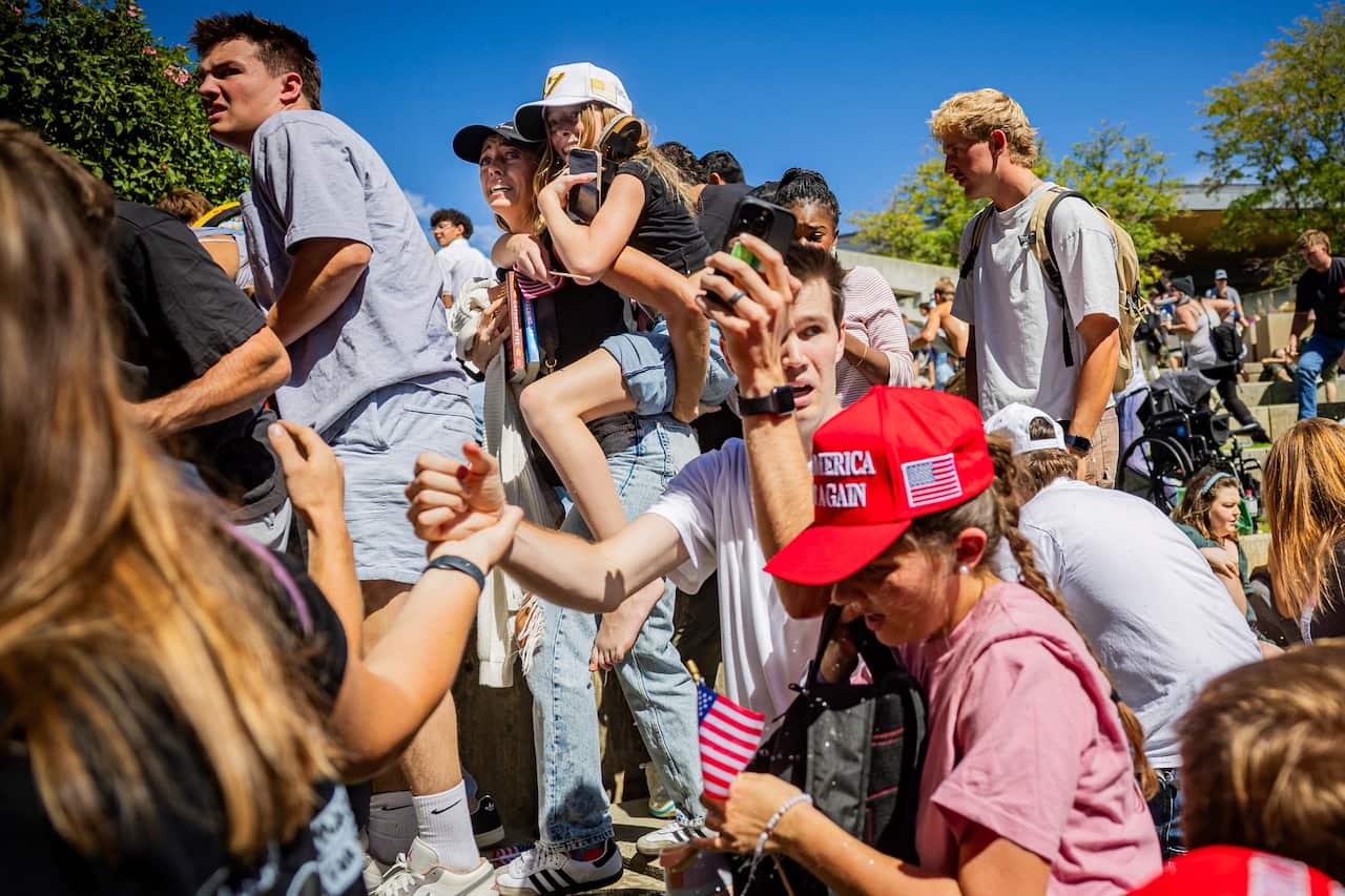 The crowd reacts after Charlie Kirk is shot and killed at a University event (AAP)