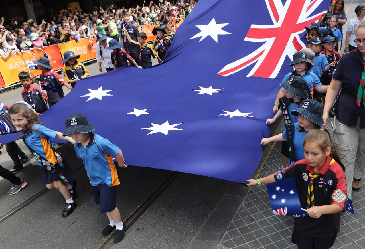 Children carry large Australia flag