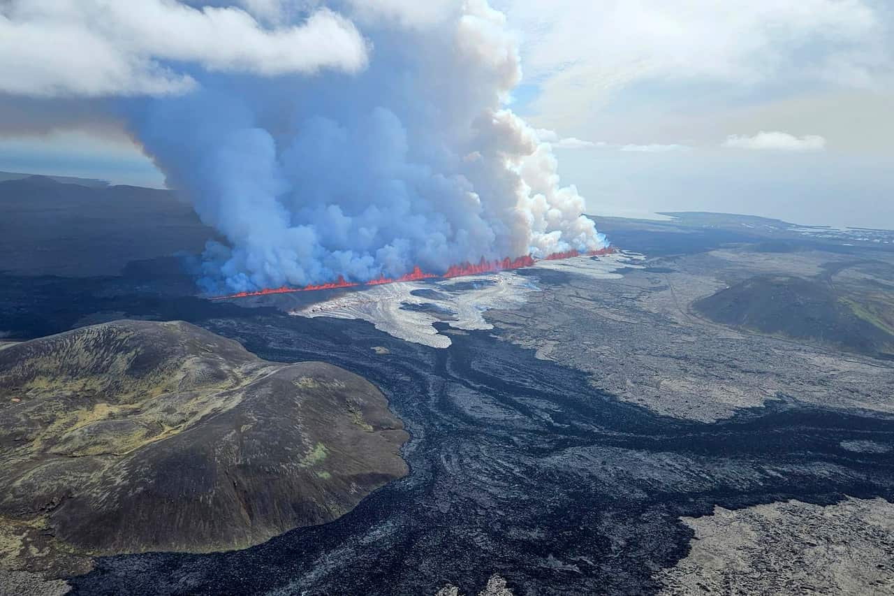 A volcano erupts in Grindavik, Iceland. Panoramic view of landscape.