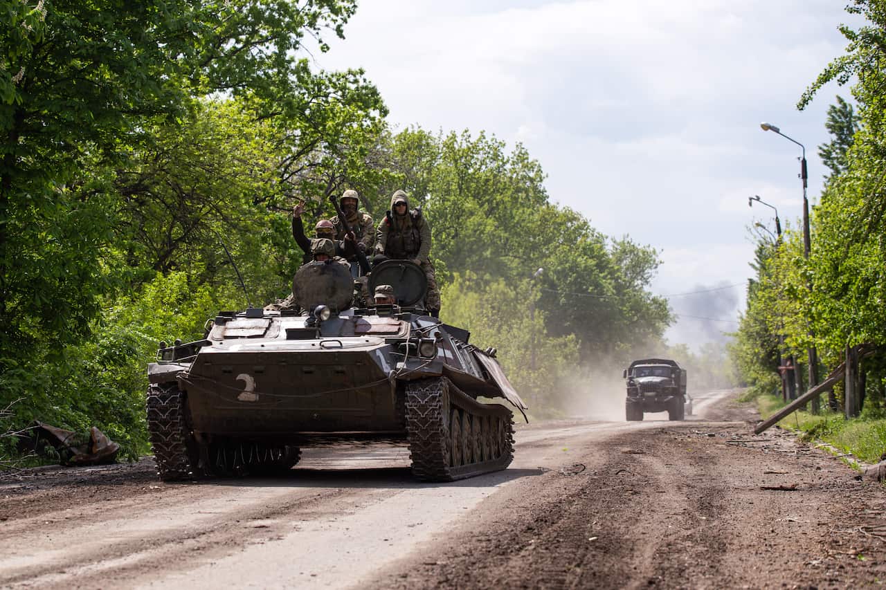 Russian Army servicemen ride an infantry combat vehicle in the town of Popasnaya which came under control of the Lugansk People's Republic on May 8.