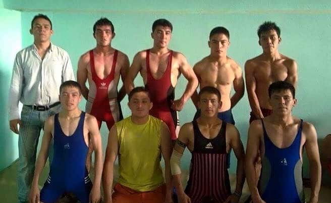 A group of young men in wrestling attire