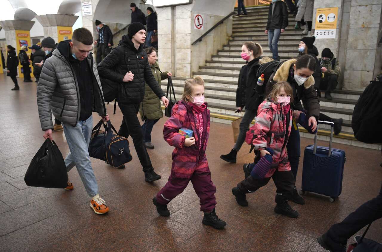 People take shelter in a metro station in Kyiv