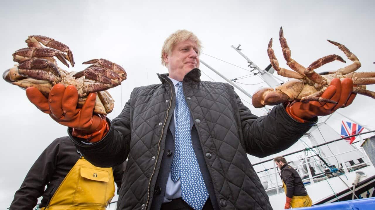 UK Prime Minister Boris Johnson holding crabs in Stromness