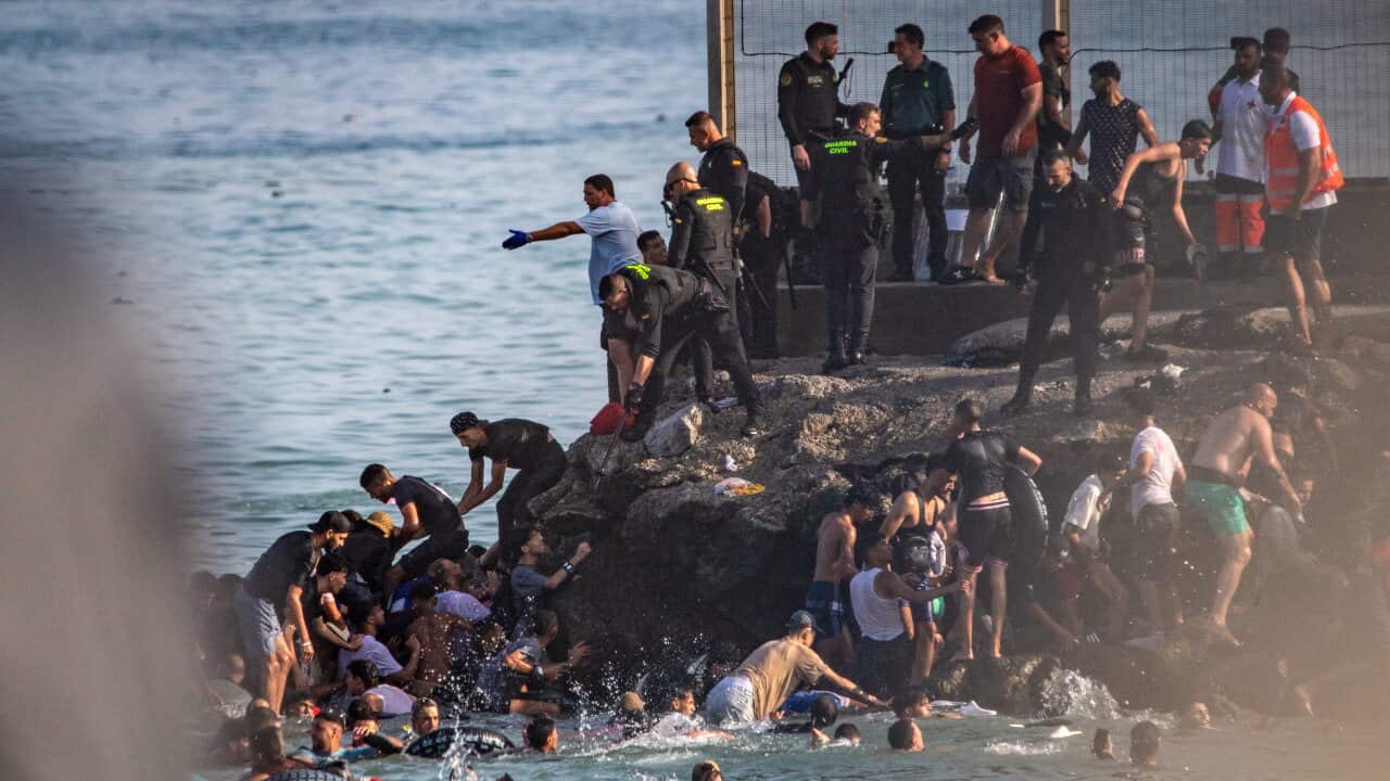 Spain calls in armed forces as hundreds of migrants enter Ceuta exclave from Morocco