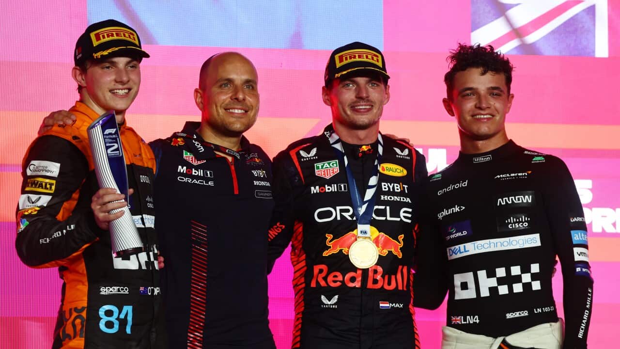 Oscar Piastri (Australia), Gianpiero Lambiase (Red Bull Racing Engineer), Max Verstappen (Netherland), and Lando Norris (Great Britain) on the podium in Qatar