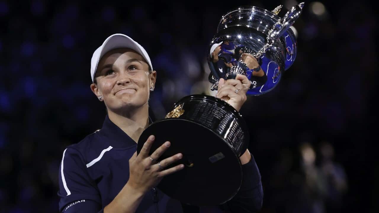 Ash Barty holds the Daphne Akhurst Memorial Cup after winning the women's singles final at the Australian Open.