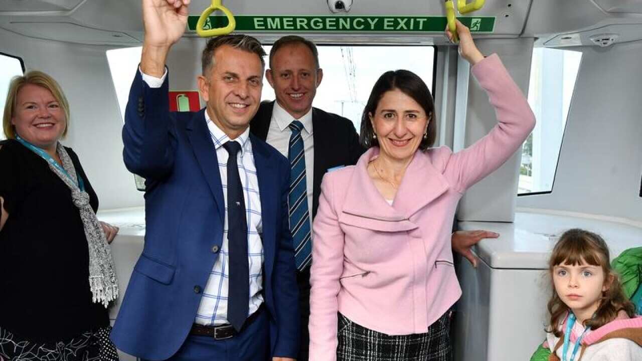 Andrew Constance and Gladys Berejiklian on the first Metro train trip.