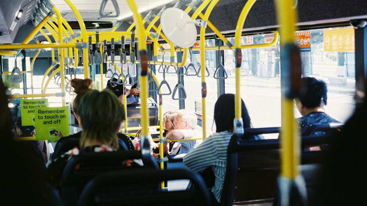 Passengers sit inside public bus by Yong Chuan Tan via Unsplash.jpg