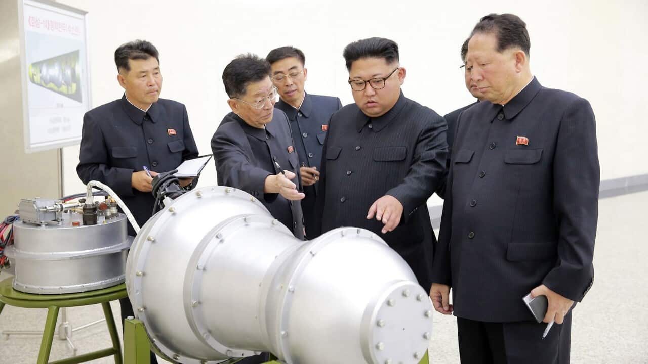 (File Image) Kim Jong Un inspects the loading of a hydrogen bomb into a new intercontinental ballistic missile.