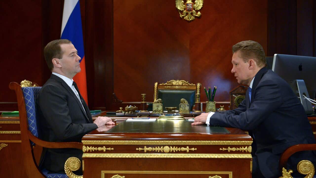 Russian Prime Minister Dmitry Medvedev (L) speaks with gas giant Gazprom CEO, Alexei Miller getty.jpg
