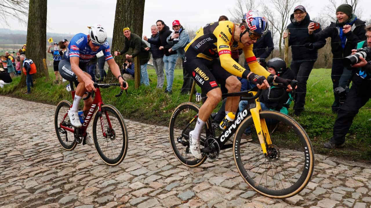 Mathieu van der Poel (Alpecin-Deceuninck) and Wout van Aert (Jumbo-Visma) traverse the cobblestones during the Tour of Flanders