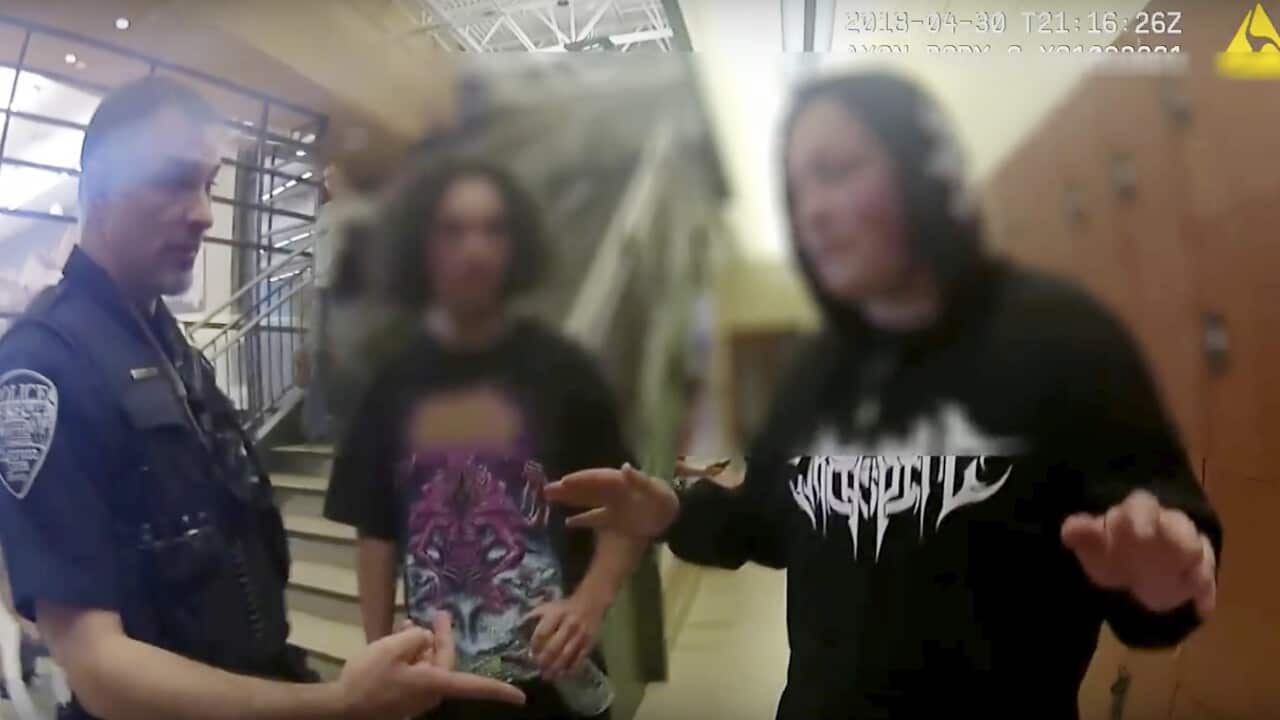 In this photo from body camera video, two Native American teenagers are questioned by Colorado State University campus police after they were pulled from a college tour, Monday, April 30, in Colorado.