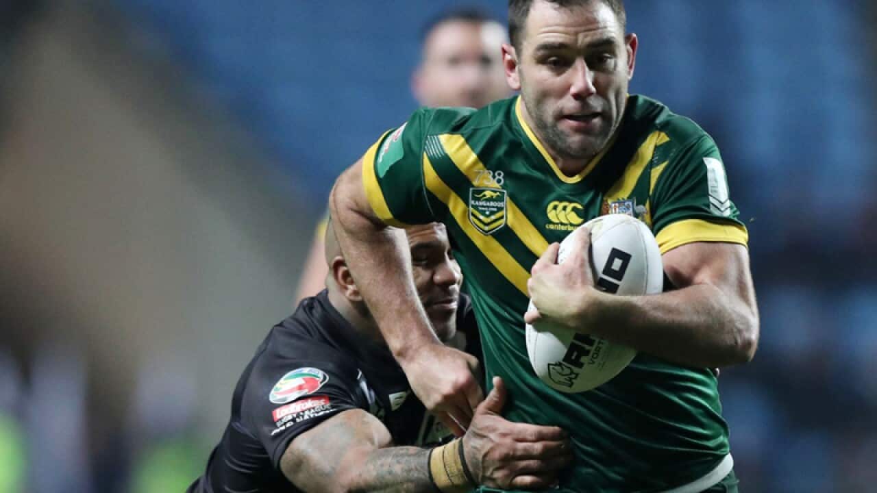 New Zealand's Manu Ma'u tackles Australia's Cameron Smith, right