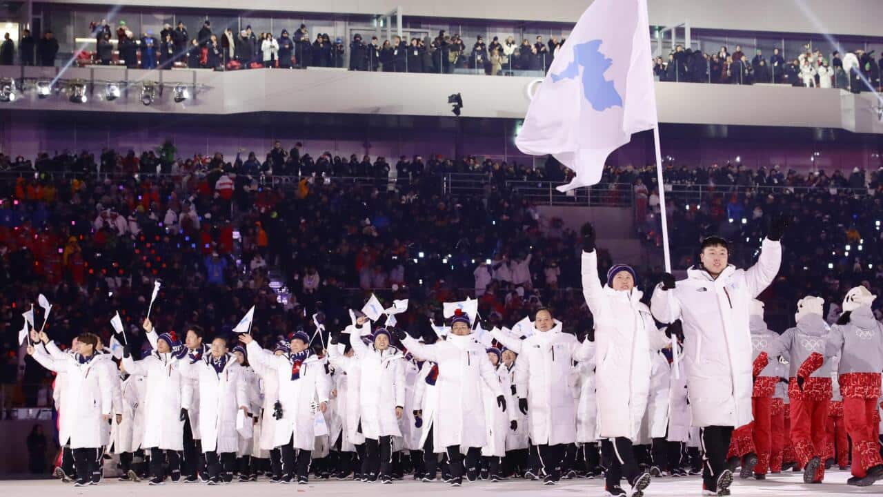 Athletes of North and South Korea enter the stadium with Korean unification flags during the opening ceremony of the Pyeongchang Winter Olympics in South Korea on Feb. 9, 2018. (Kyodo)==Kyodo
