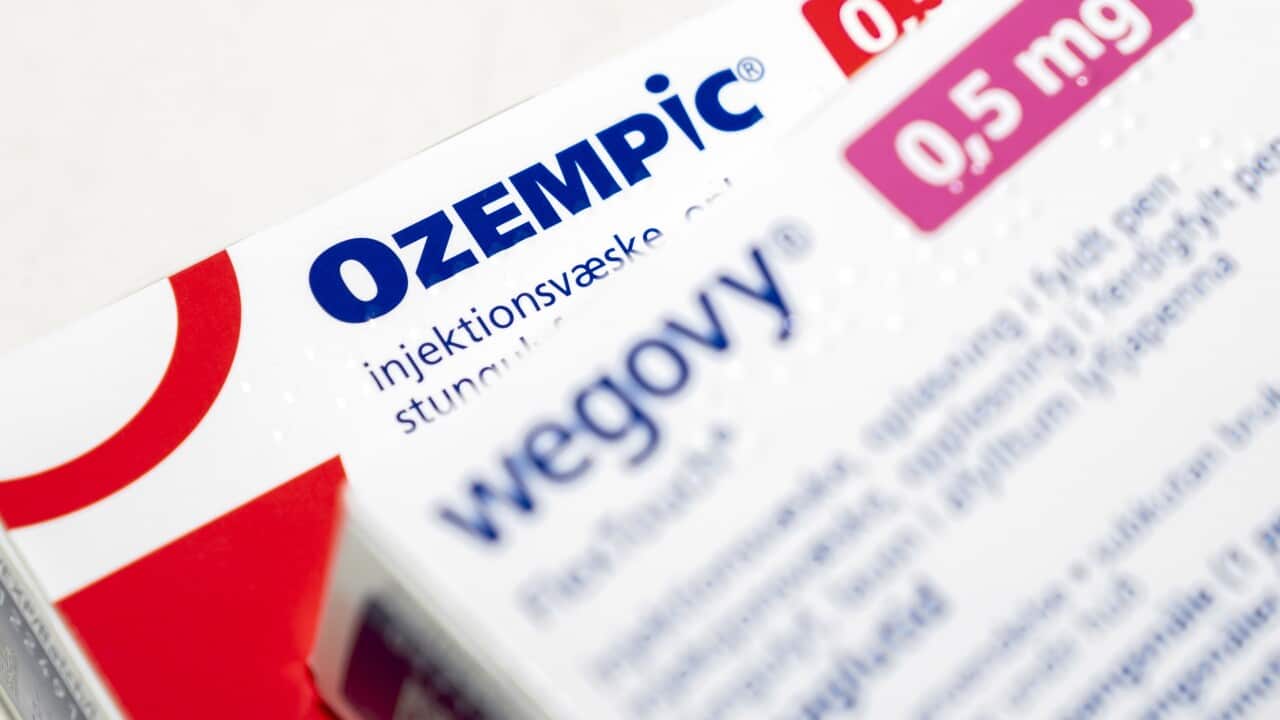 Two boxes of pharmaceutical drugs named Ozempic and Wegovy placed on the table.