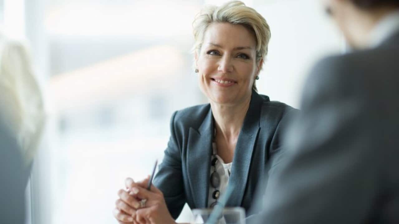 Smiling businesswoman in meeting