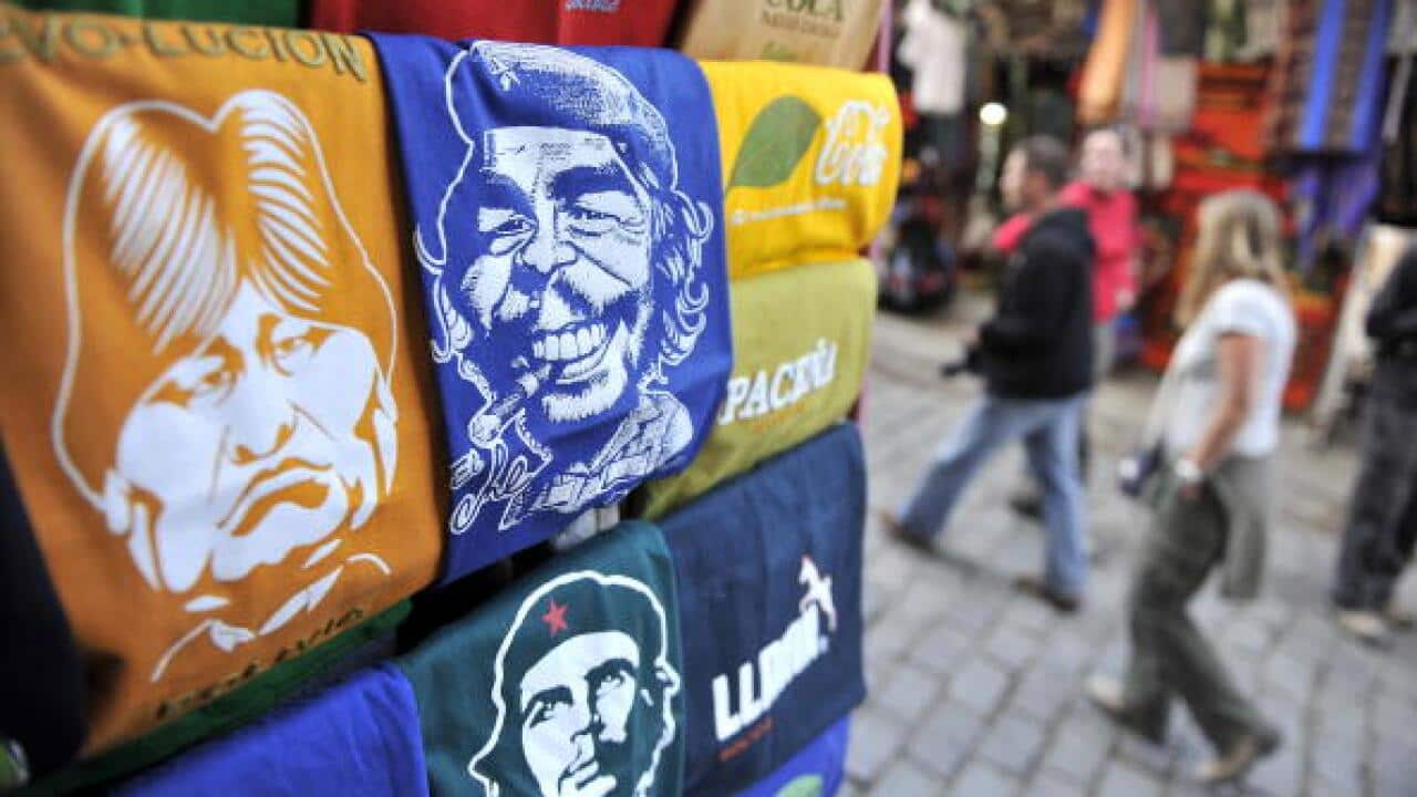 A T-shirt stand is seen selling garmets