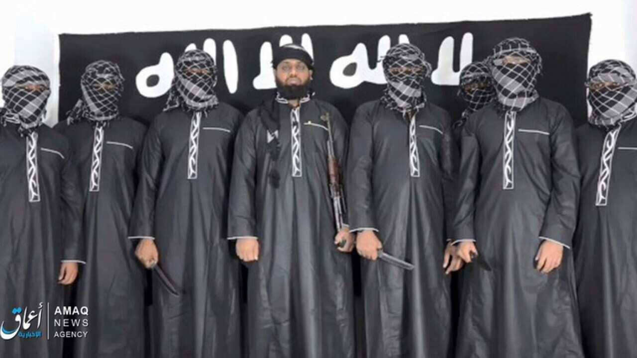 Image posted by the IS Aamaq news agency, purporting to show Mohammed Zahran (c) the man Sri Lanka says led the Easter attacks (AAP)