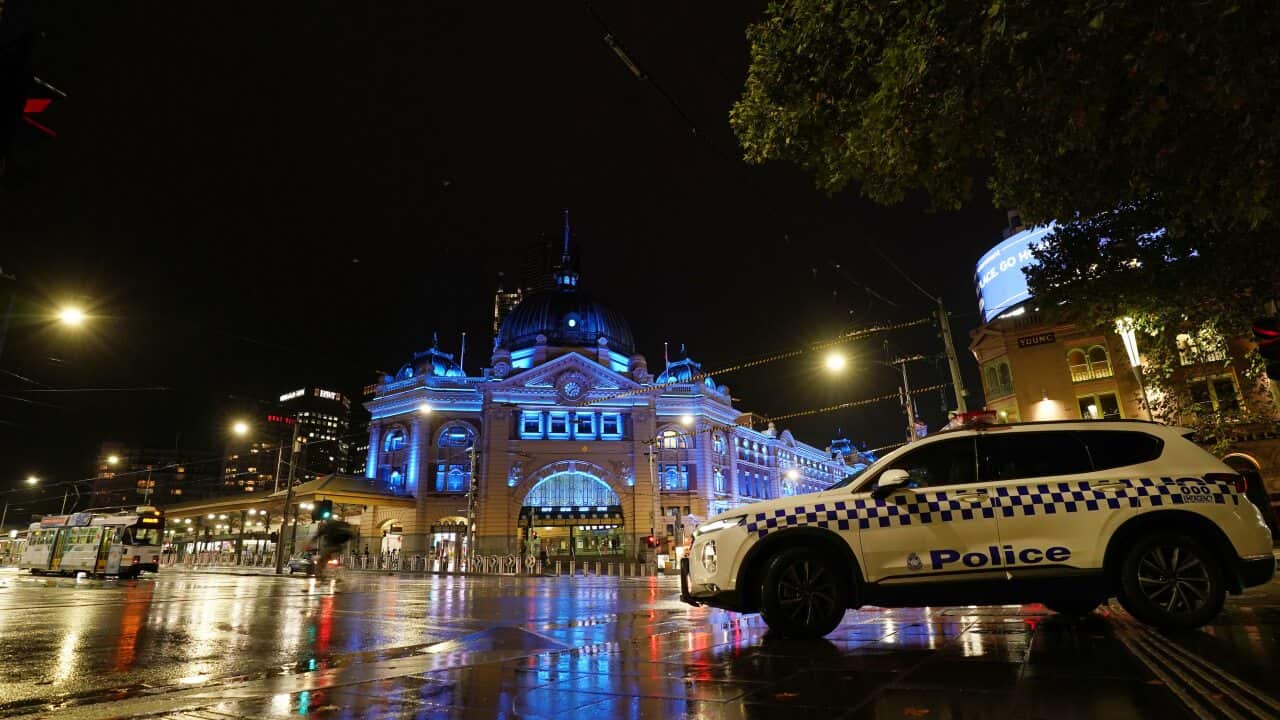 Flinders Street Station is lit up in blue in tribute to four police officers that died after being hit by a truck on Melbourne's Eastern Freeway.