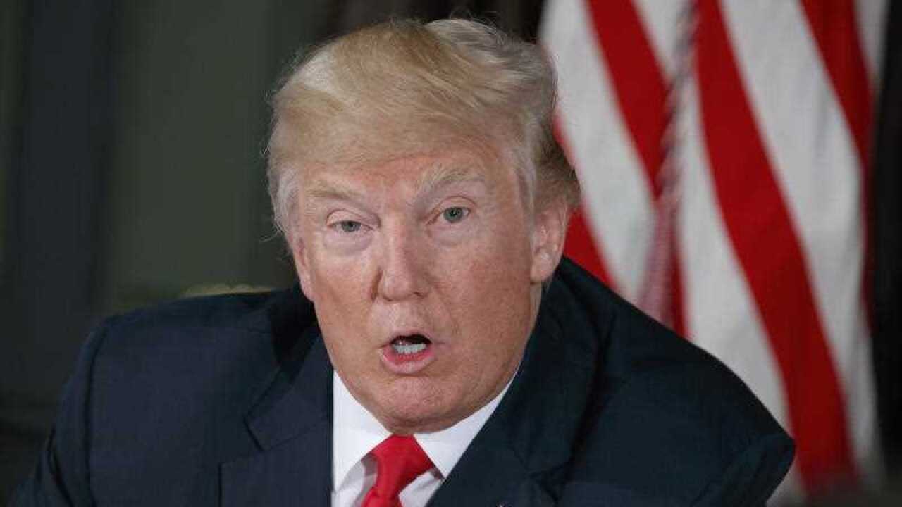 In this Tuesday, Aug. 8, 2017, file photo, President Donald Trump speaks during a briefing at Trump National Golf Club in Bedminster, N.J.