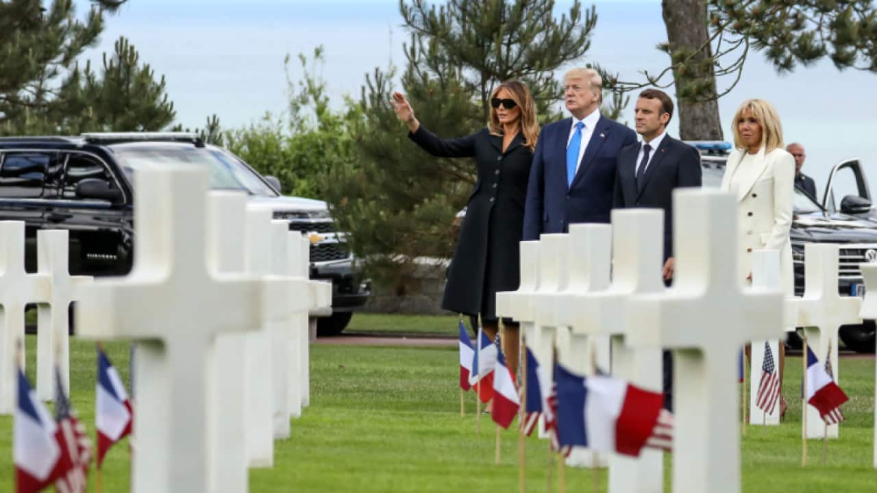 US First Lady Melania Trump, US President Donald Trump, French President Emmanuel Macron and French President's wife Brigitte Macron.