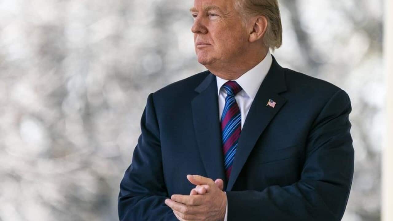 US President Donald J. Trump prepares to speak at the White House.