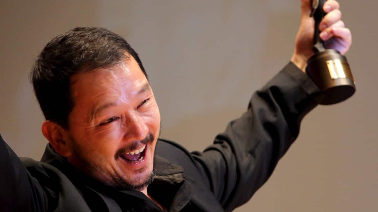 Hong Kong actor Liu Kai Chi celebrates with the trophy after winning the Best Supporting Actor award for his role in the movie 'The Beast Stalker' at the 28th Hong Kong Film Awards, in Hong Kong, China, 19 April 2009.