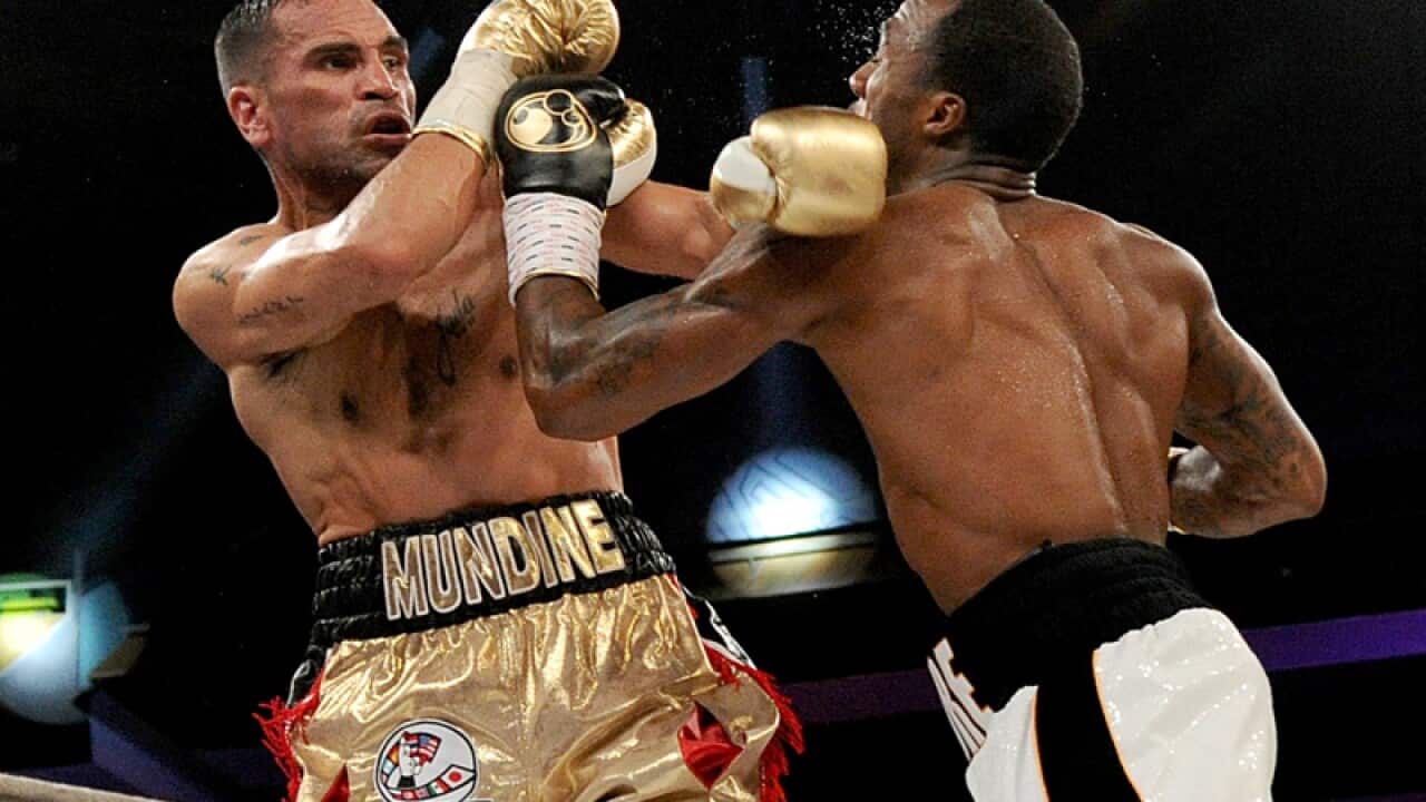 Anthony Mundine of Australia (left) clashes with US's Charles Hatley